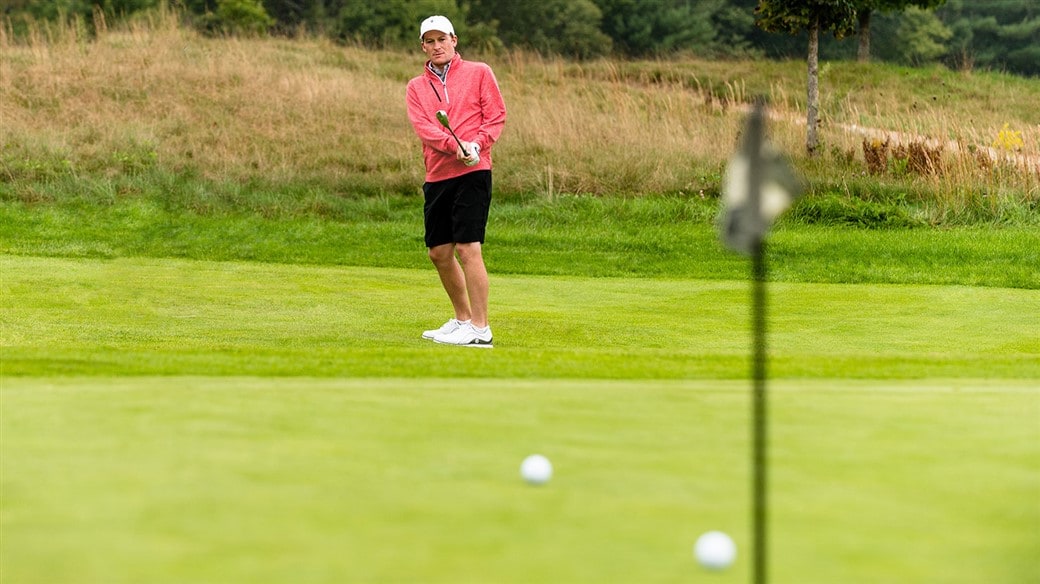 Golfer plays with two golf balls to compare and find the right golf ball for their game